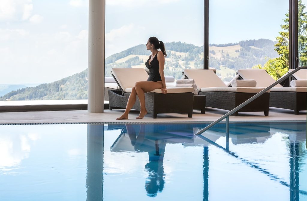 a woman sitting on a pool