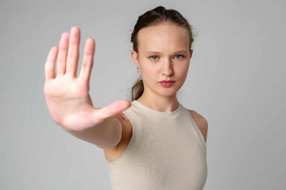 Young Woman Making Stop Sign With Hands