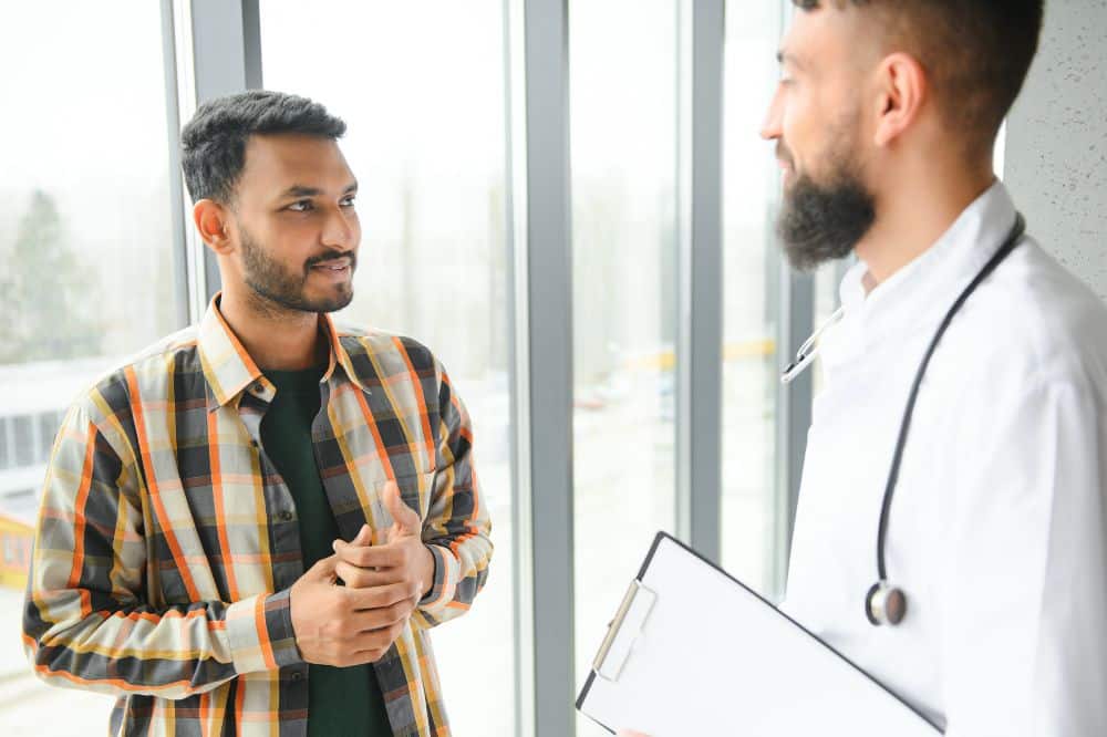 man being examined by a doctor